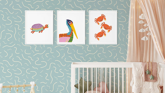 A nursery with an aquatic nature theme, including a water-themed wallpaper and art prints with turtles, birds, and crabs