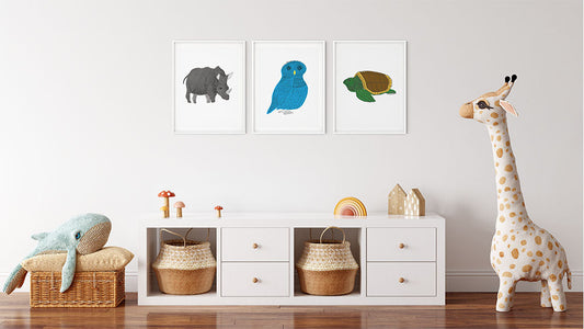 Three framed animal illustrations as nursery decor