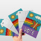 4x6 voter outreach postcard featuring a colorful rainbow butterfly with the hand-lettered word “VOTE” by Erwin Ong.