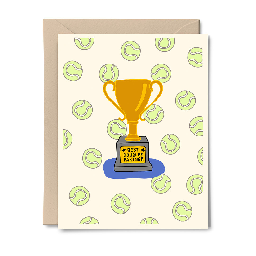 Greeting card featuring a gold “Best Doubles Partner” trophy surrounded by green tennis balls, digitally illustrated by Erwin Ong.