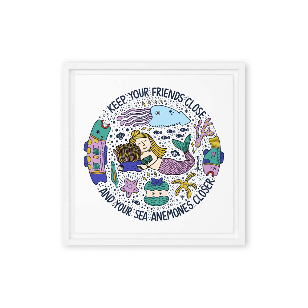 Mermaid hugging sea anemone surrounded by colorful ocean creatures with the phrase “Keep your friends close and your sea anemones closer” – framed square canvas wall art in white floating frame.